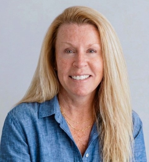 blonde woman wearing a blue shirt